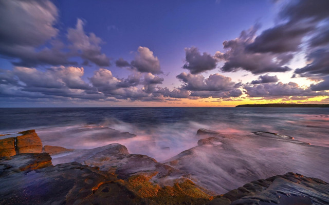 Rocky beach sunset clouds cityscape free wallpaper for desktop - medium preview image