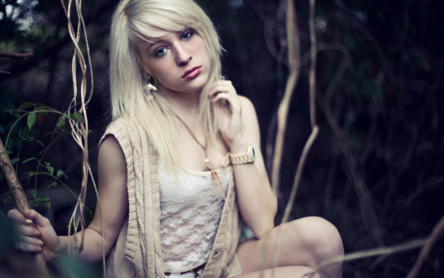 Woman branch forest blonde serious free wallpaper for desktop - medium preview image