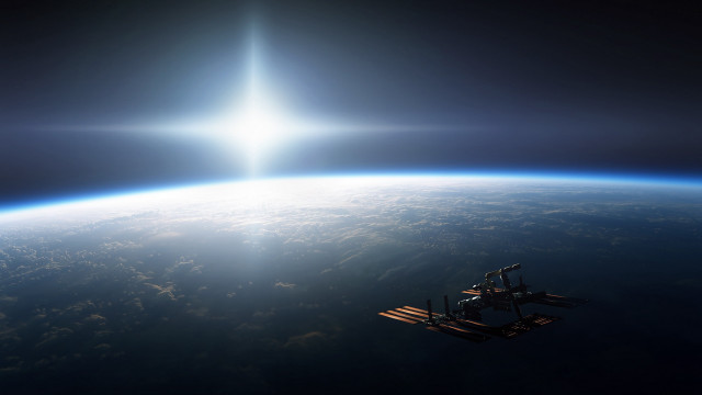 Space station earth sunlight beam free wallpaper for desktop - medium preview image