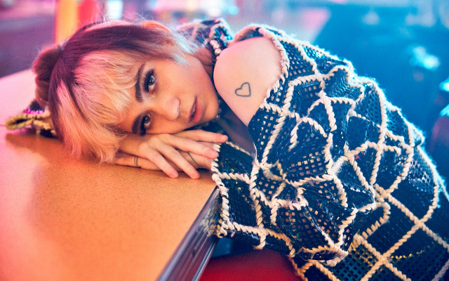 Woman heart tattoo leaning table free wallpaper for desktop - medium preview image