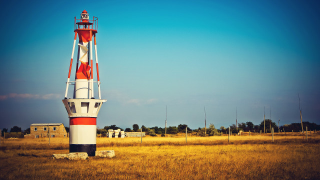 Lighthouse field constructivism tiltshift saturated free wallpaper for desktop - medium preview image