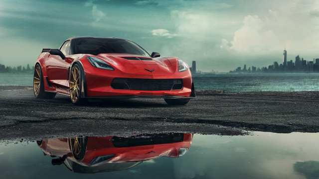 Red sports car beach cityscape free wallpaper for desktop - medium preview image