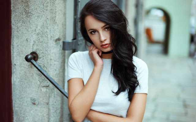 Woman leaning wall serious face #2 free wallpaper for desktop - medium preview image
