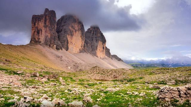 Mountain range rocks grass cloudy free wallpaper for desktop - medium preview image