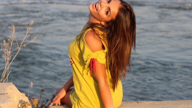 Woman yellow dress water ponytail free wallpaper for desktop - medium preview image