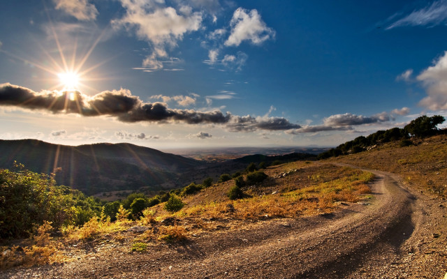Dirt road mountains sunshine clouds free wallpaper for desktop - medium preview image