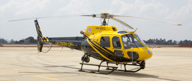 Yellow helicopter airport tarmac clouds free wallpaper for desktop - medium preview image