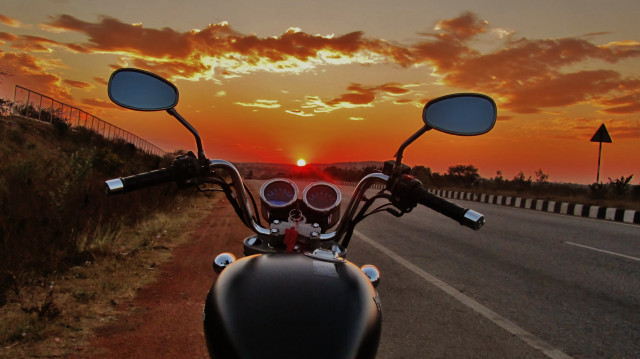 Motorcycle parked sunset road distance free wallpaper for desktop - medium preview image