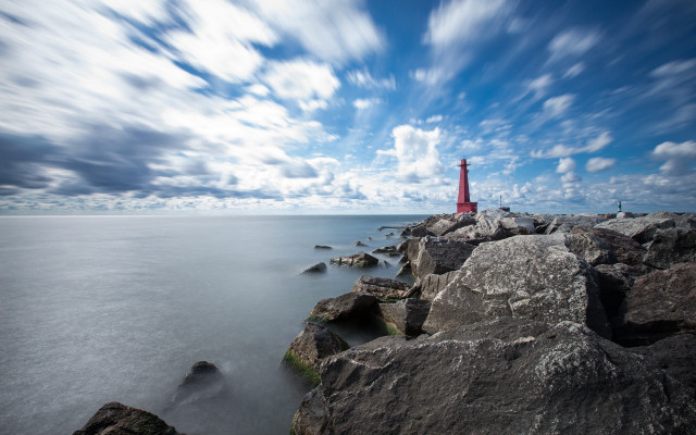 Red lighthouse rocky shore cloudy free wallpaper for desktop - medium preview image