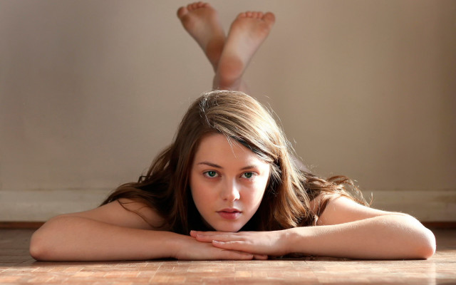 Woman lying crossed legs green free wallpaper for desktop - medium preview image