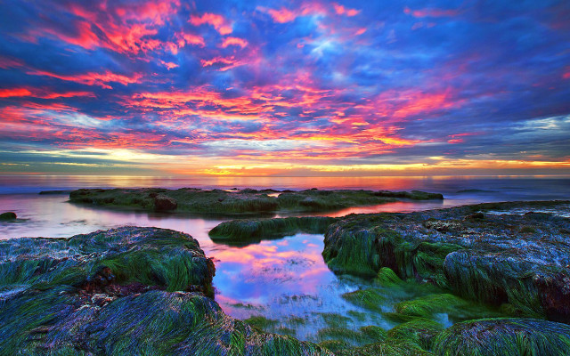 Colorful sunset rocky beach water free wallpaper for desktop - medium preview image