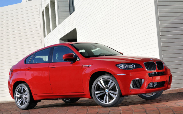 Red car building white wall free wallpaper for desktop - medium preview image