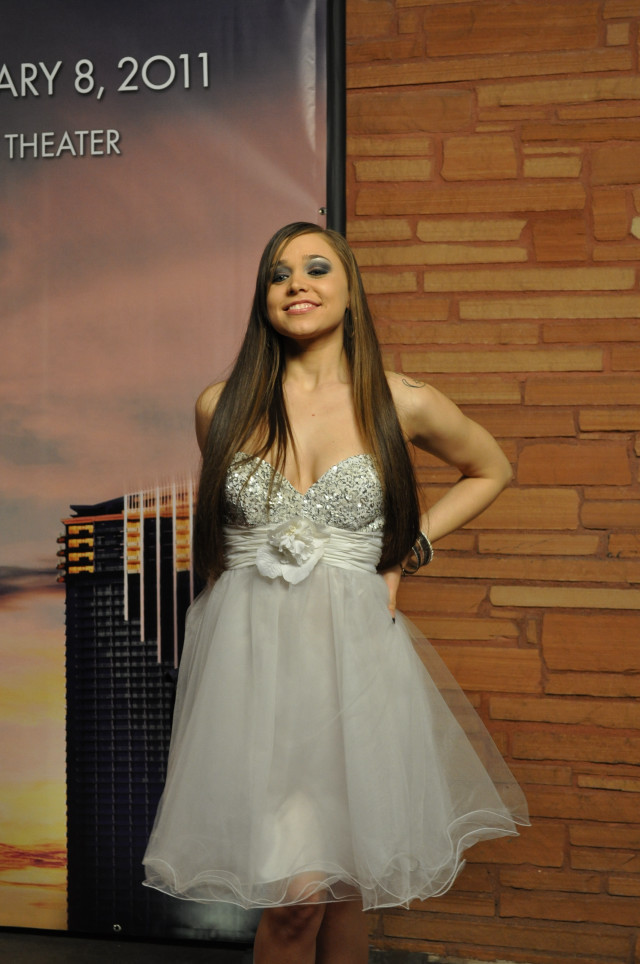 Woman short dress cityscape building free wallpaper for mobile - medium preview image