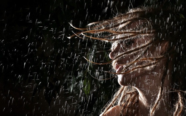 Woman dreadlocks rain wind cityscape free wallpaper for desktop - medium preview image