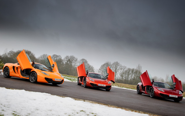 Orange sports cars snowy road free wallpaper for desktop - medium preview image