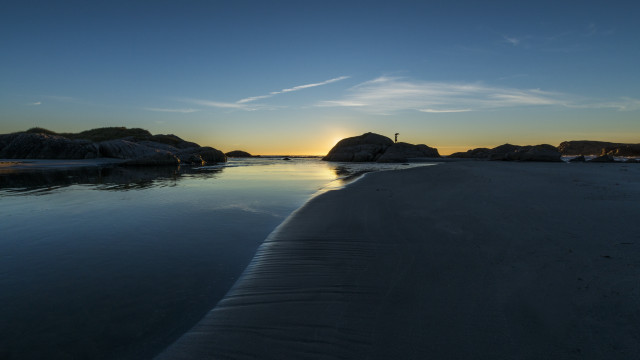 Beach rocks sunset person lake free wallpaper for desktop - medium preview image