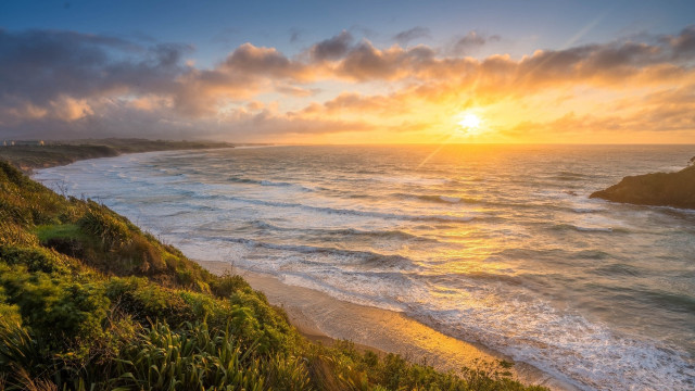 Sunset ocean beach cliff cityscape free wallpaper for desktop - medium preview image