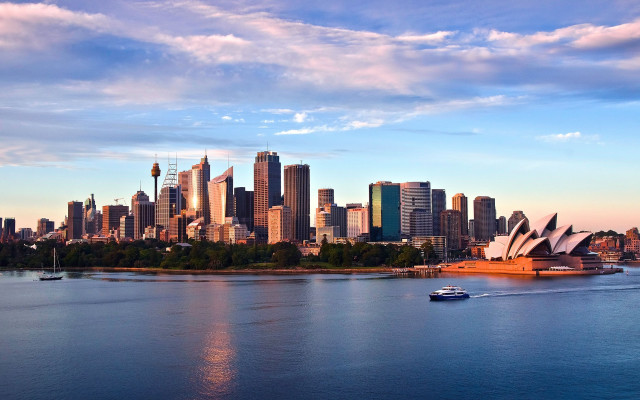 City skyline boat clouds blue free wallpaper for desktop - medium preview image