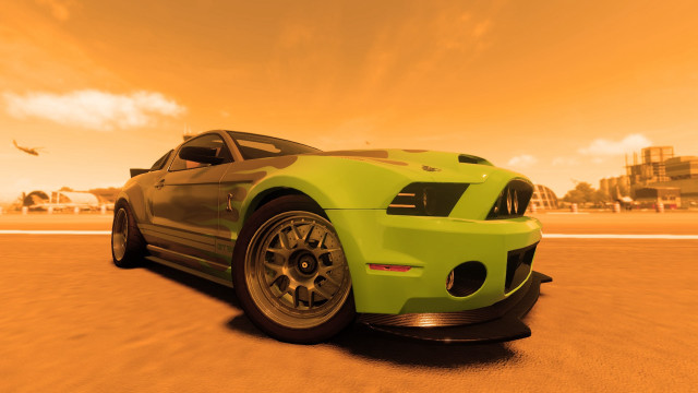 Green car desert road city free wallpaper for desktop - medium preview image