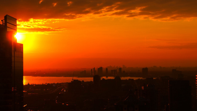 Sunset city river skyline embers free wallpaper for desktop - medium preview image