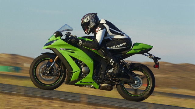 Motorcycle rider green road field free wallpaper for desktop - medium preview image