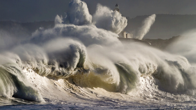 Large wave beach lighthouse cloudy free wallpaper for desktop - medium preview image