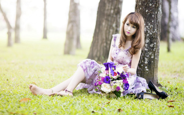 Woman sitting in grass bouquet free wallpaper for desktop - medium preview image
