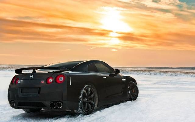 Black sports car snow sunset free wallpaper for desktop - medium preview image