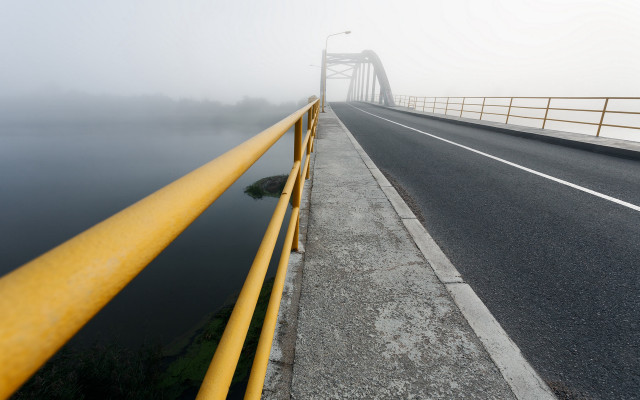 Foggy road yellow railings water free wallpaper for desktop - medium preview image
