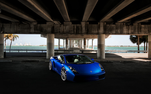 Blue sports car bridge ocean free wallpaper for desktop - medium preview image