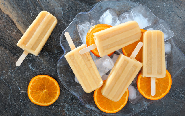 Orange slice couple on ice free wallpaper for desktop - medium preview image