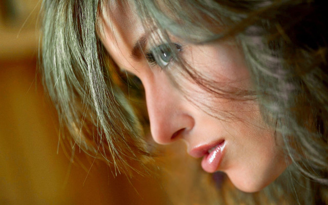 Woman cellphone blurry background portrait free wallpaper for desktop - medium preview image