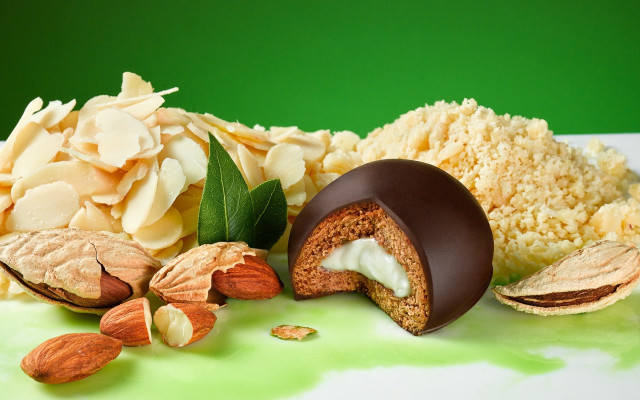 Chocolate candy almonds green background free wallpaper for desktop - medium preview image