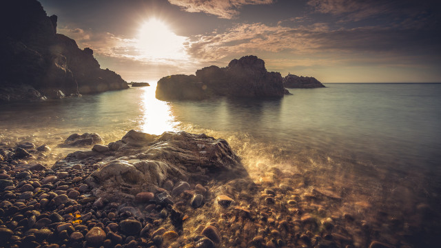 Rocky beach sunset ocean mountain free wallpaper for desktop - medium preview image