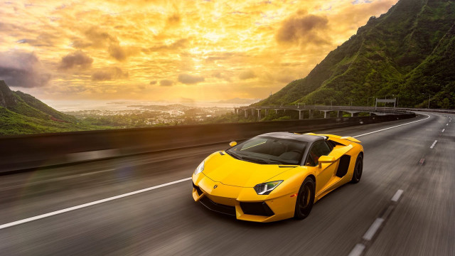 Yellow sports car mountain sunset free wallpaper for desktop - medium preview image