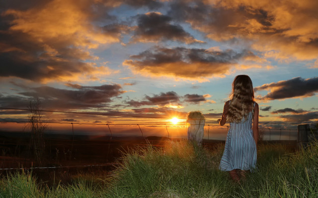 Woman sunset green field clouds free wallpaper for desktop - medium preview image