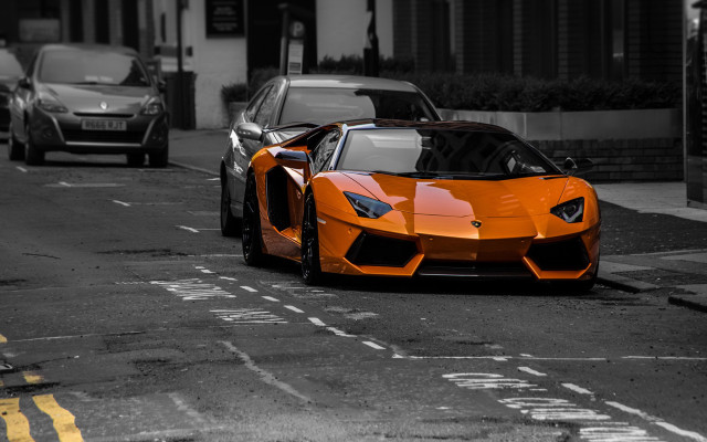 Orange sports car city street free wallpaper for desktop - medium preview image