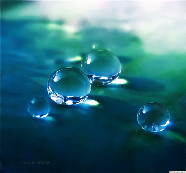 Three water droplets floating on free wallpaper for tablet - medium preview image
