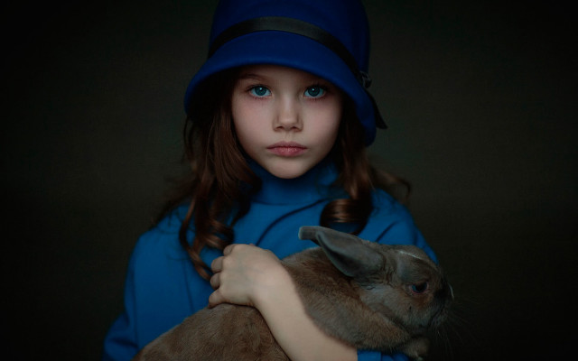 Young girl holding rabbit blue free wallpaper for desktop - medium preview image