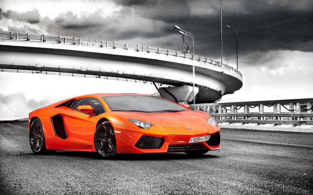 Orange sports car parking lot free wallpaper for desktop - medium preview image