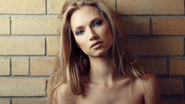 Woman longhair brickwall portrait photorealistic free wallpaper for desktop - medium preview image