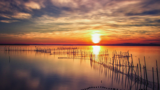 Sunset water poles boats crepuscular free wallpaper for desktop - medium preview image