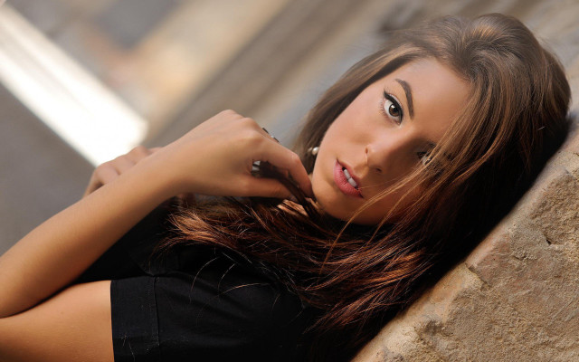 Woman portrait serious browneyes longhair free wallpaper for desktop - medium preview image