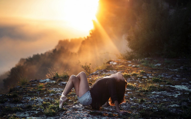 Woman rocky hillside sunset cinematic free wallpaper for desktop - medium preview image