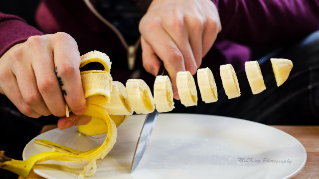 Person cutting banana plate knife free wallpaper for desktop - medium preview image