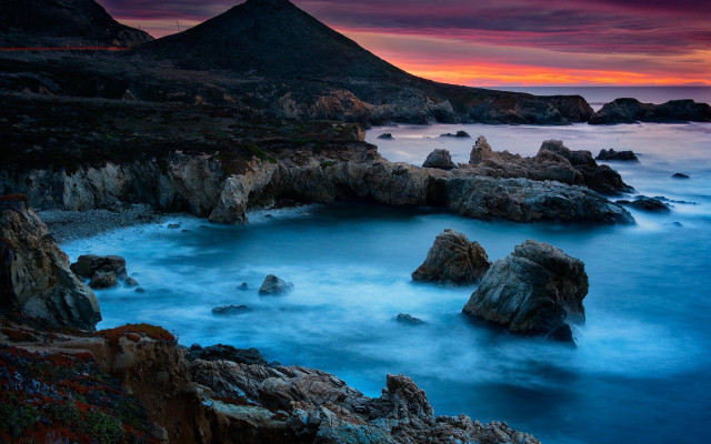 Rocky beach mountain sunset water free wallpaper for desktop - medium preview image