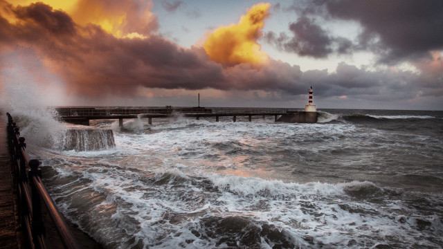 Lighthouse waves stormy sky cityscape free wallpaper for desktop - medium preview image