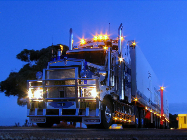 Large semi truck parking road free wallpaper for desktop - medium preview image
