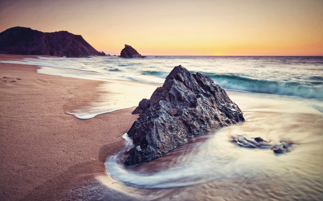 Rock sand beach sunset waves free wallpaper for desktop - medium preview image