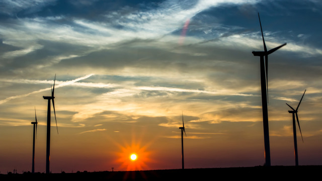 Sunset windmills clouds sky background free wallpaper for desktop - medium preview image